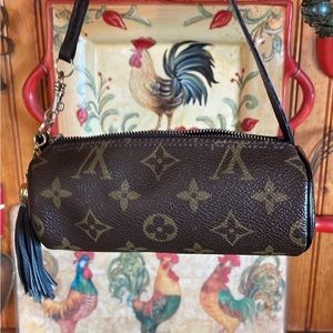 Louis Vuitton miniature Papillion handbag piping is dyed black.